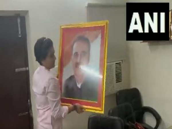Praful Patel's photo frame being removed from Nationalist Student Congress office (Photo/ANI)