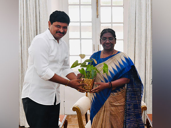 Rajya Sabha MP Joginpally Santosh Kumar presented a sapling to President Murmu. (Photo/ANI)