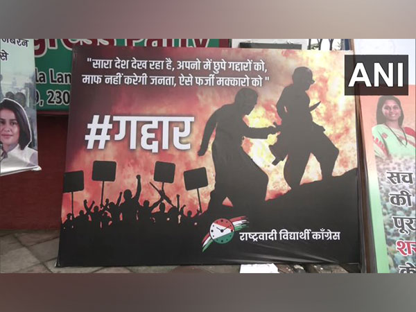 Rashtrawadi Vidyarthi Congress' poster with 'Gaddaar' (traitor) written on it outside party office in Delhi. (Photo/ANI)