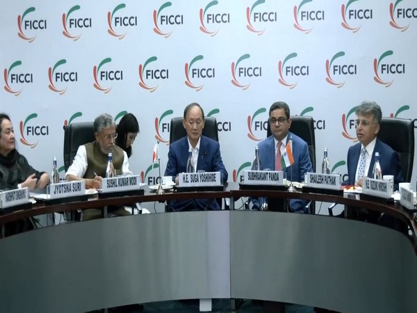 Former Japanese Prime Minister Yoshihide Suga addresses the FICCI event (Photo/ANI)