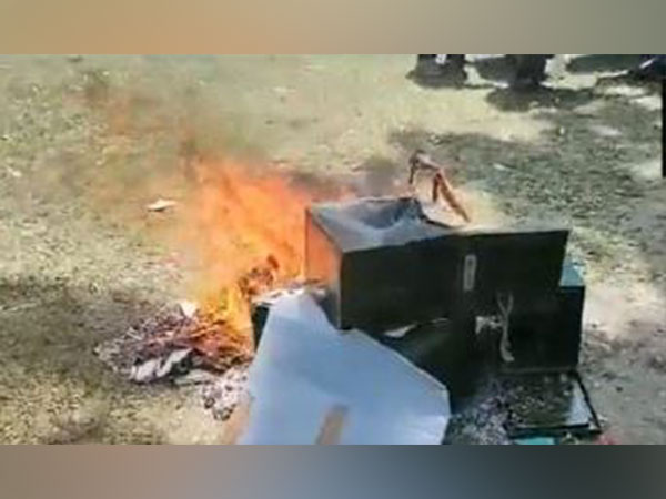 Ballot box at a polling booth in Baranachina of Dinhata in Cooch Behar district was set on fire (Photo/ANI)
