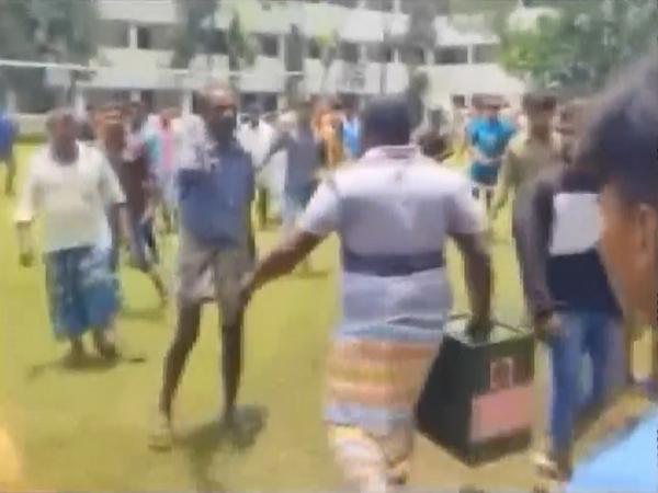 A miscreant runs away with the ballot box from the polling station in Malda's Mahadipur area. (Photo/ANI)