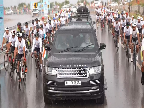 Prime Minister Narendra Modi's road show accompanied by cyclists. (Photo/ANI)