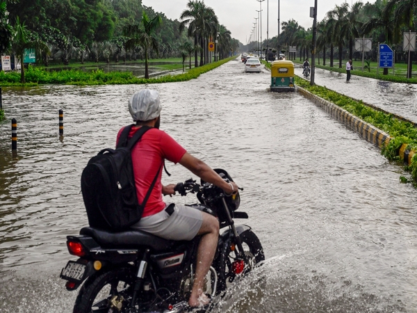 A view of a severely waterlogged road after heavy rainfall in New Delhi. (Photo/ANI)