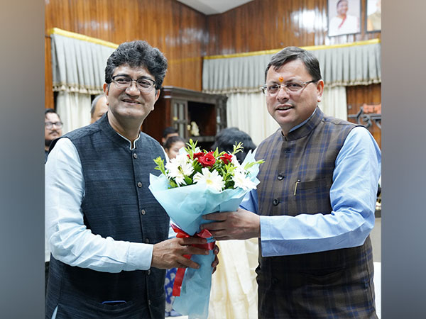 Chief Minister Pushkar Singh Dhami with Prasoon Joshi (Photo/ANI)