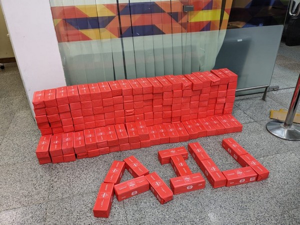 1.93 kgs gold and 62,400 cigarette sticks seized at Hyderabad Airport. (Photo/ANI)