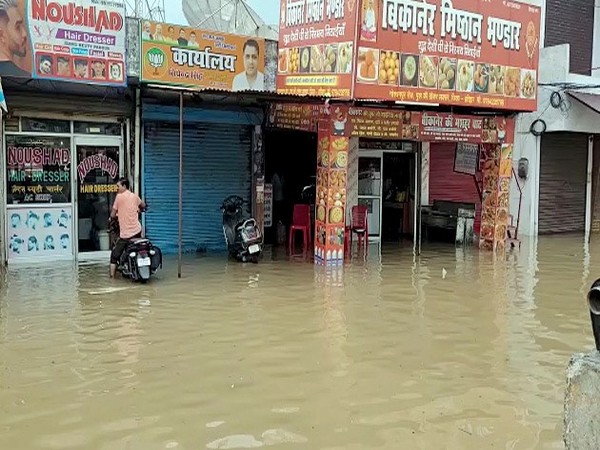 Shops inundated with floodwater following heavy rainfall in Laksar (File Photo/ANI)