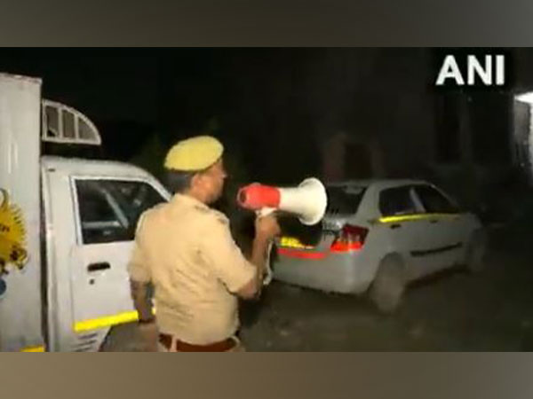 Police alerting people regarding the rising water level in the Hindon River on Saturday. (Photo/ANI)