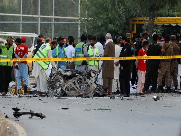 Army soldiers, police officers and rescue workers gather at the site of a suicide attack near a paramilitary force vehicle in Peshawar, Pakistan July 18, 2023. (Photo/Reuters)
