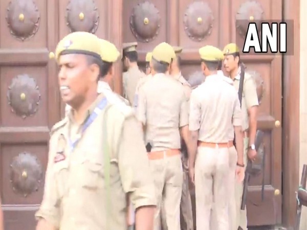Police officials enter Gyanvapi mosque complex. (ANI/photo)