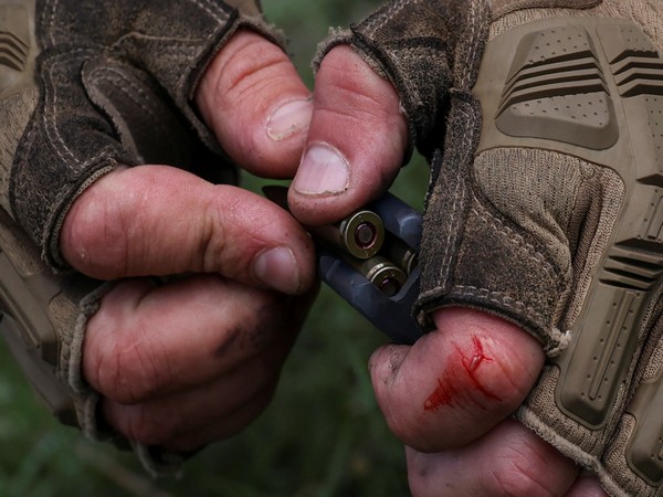 A Ukrainian serviceman loads cartridges to a magazine amid Russia's attack on Ukraine. (Photo Credit: Reuters)
