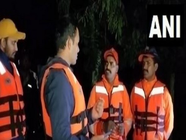 An NDRF team rescued 80 tourists stuck at mutyala dhara waterfall, in Telangana's Mulugu district (Photo/ANI)