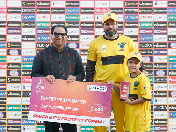 Yusuf Pathan receiving his 'Player of the Match' award with his son. (Photo- Zim Afro T10)