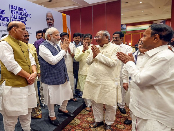 Prime Minister Narendra Modi greets the National Democratic Alliance (NDA) leaders  in New Delhi on Tuesday. (ANI/Photo)