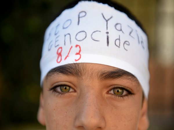 An Iraqi Yazidi refugee boy attends a commemoration in 2017 (Image Credit: reuters)