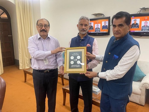 India’s G20 Sherpa Amitabh Kant with Chief Coordinator Harsh V Shringla presents commemorative postage stamps and coins to EAM Jaishankar. (Photo Credits: Twitter/@@g20org)