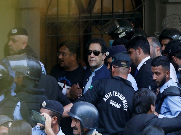 Security officers escort Pakistan's former Prime Minister Imran Khan as he appeared in Islamabad High Court on May 12, 2023. (File Photo/Reuters)