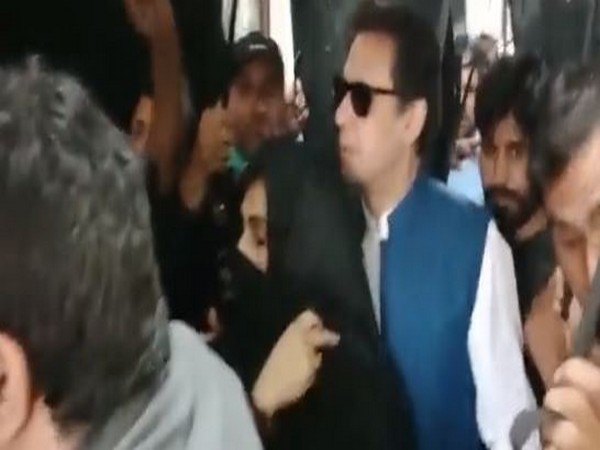 PTI Chief Imran Khan with his wife Bushra Bibi. (Photo Credit - Twitter/The Truth International)