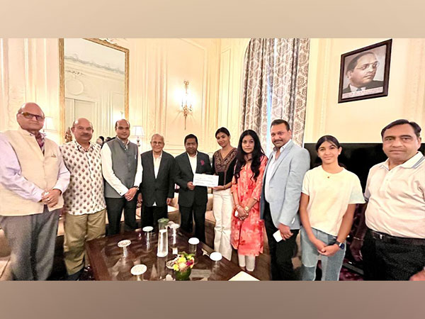 Tanishka presents funds to the Consul General of India in New York. (Photo/ANI)