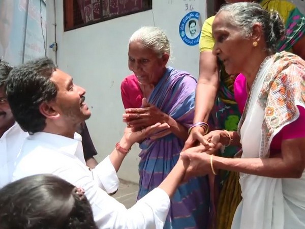 CM Jagan Mohan Reddy while interacting with flood victims (Photo/ ANI)