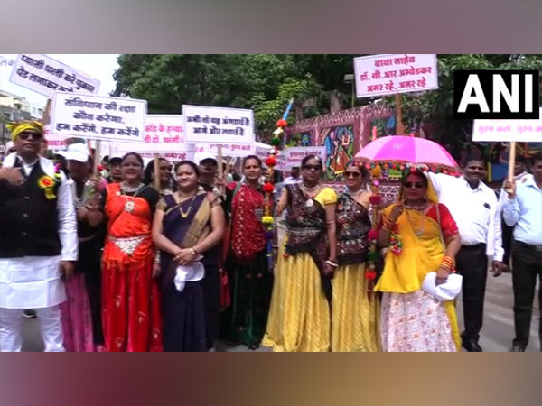 Tribal people in their traditional costumes during rally (Photo/ANI) 