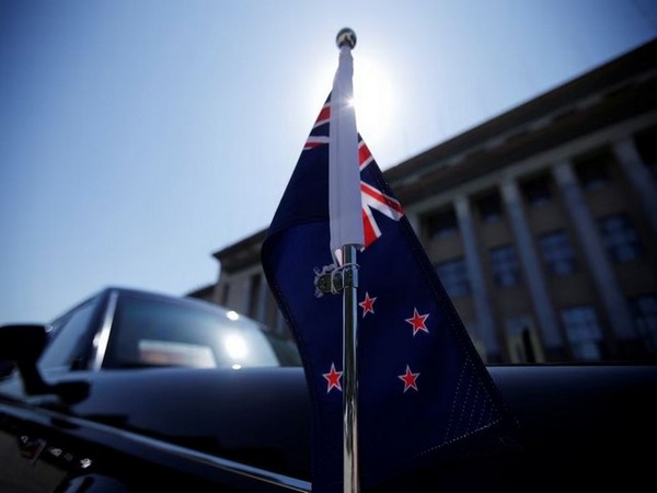 A car with a New Zealand flag waits for New Zealand former Prime Minister Jacinda Ardern (Image Credit: Reuters)