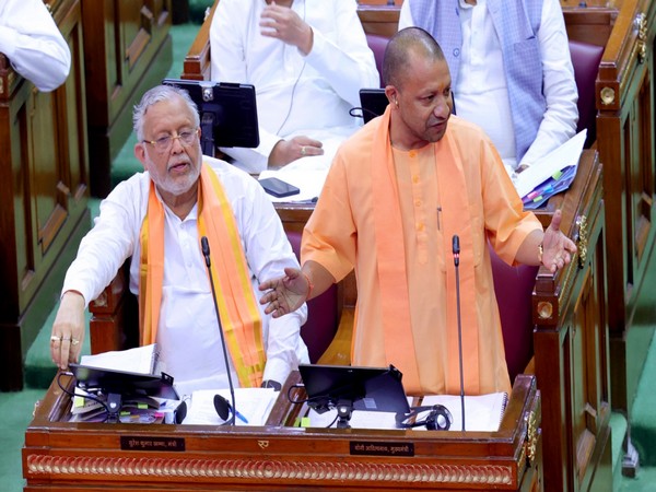 Uttar Pradesh Chief Minister Yogi Adityanath (Right) (Photo/ANI)