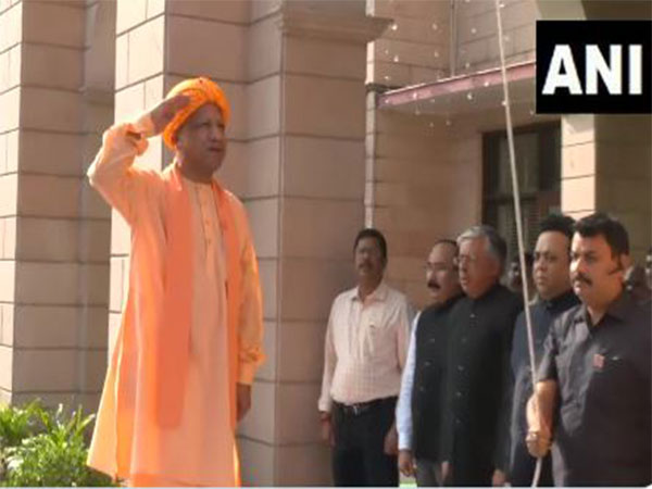 Uttar Pradesh Chief Minister Yogi Adityanath hoisting Tiranga (Photo/ANI)