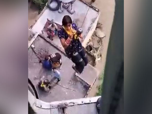 A woman being rescued by IAF helicopter. (Photo/IAF)