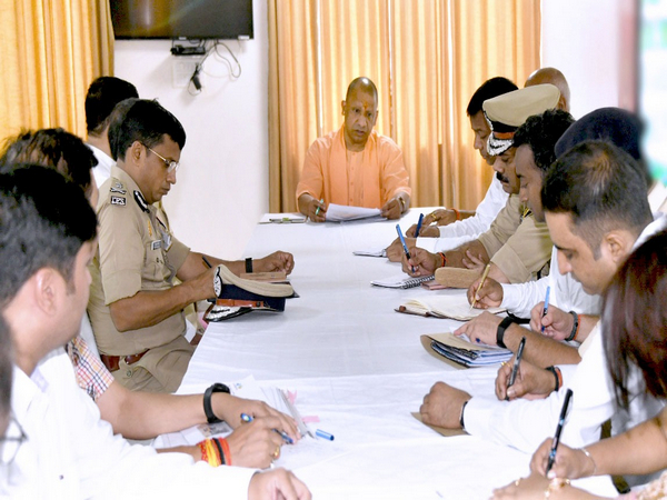 Uttar Pradesh Chief Minister Yogi Adityanath holds meeting with state police personnel. (Photo/ANI)