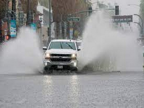 A truck moves through standing water as Tropical Storm Hilary approaches Palm Springs, California, US (Image Credit: Reuters)