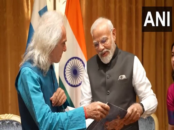PM Modi meets Greek researcher and musician, Konstantinos Kalaitzis in Athens. (Photo: ANI)