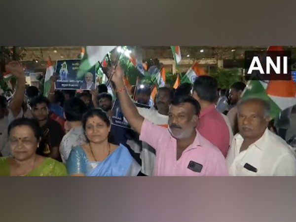 People gather outside HAL airport in Bengaluru to welcome Prime Minister Narendra Modi (Photo/ANI)