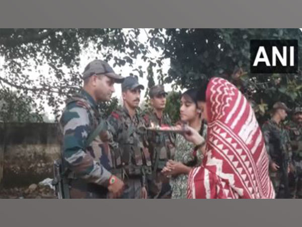 Local girls celebrate Raksha Bandhan with Army jawans in Akhnoor sector in J-K (Photo/ANI)