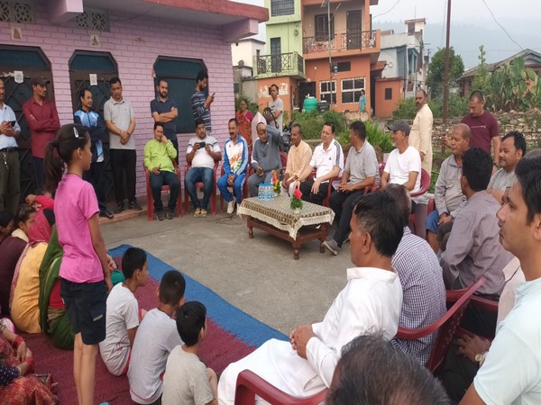 Uttarakhand Chief Minister Pushkar Singh Dhami interacts with villagers in Bageshwar's Garur (Photo/ANI)