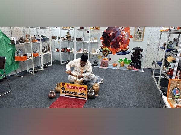 Dilshad Hussain with his carving. (Photo/ANI)