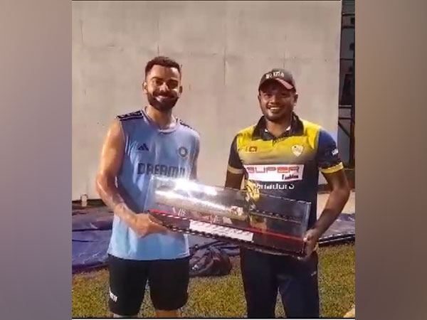 Virat Kohli with Sri Lankan cricketer (Photo: ANI)