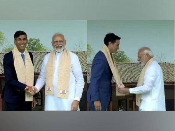 Prime Minister Narendra Modi welcomes UK PM Rishi Sunak and Canadian PM Justin Trudeau at Rajghat in New Delhi on Sunday. (Photo/ANI)