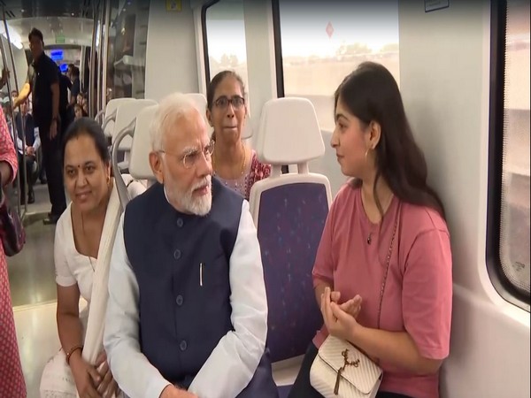 A traveller on Delhi metro greets Prime Minister Narendra Modi on his birthday (Photo/ANI)