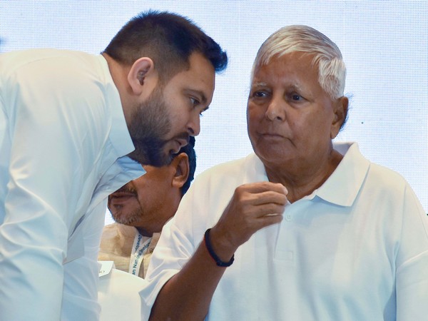 Former Bihar chief minister Lalu Prasad Yadav with son Tejashwi Yadav. (Photo/ANI)