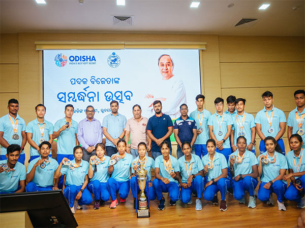 Odisha Sports Minister Tusharkanti Behera with athletes (Photo/ANI)