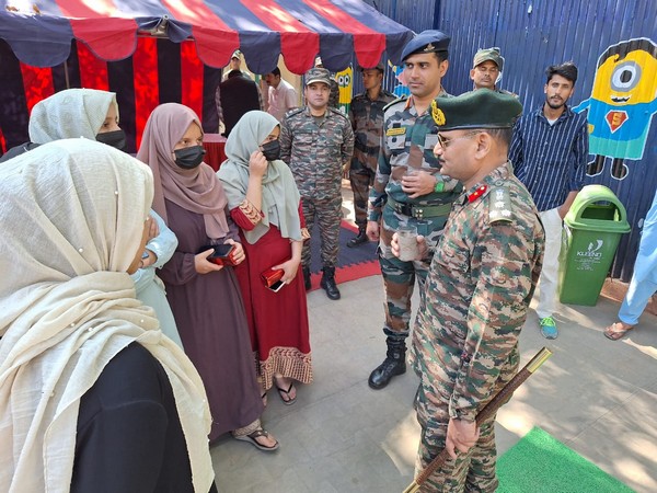 Army officials with students (Photo/ANI)