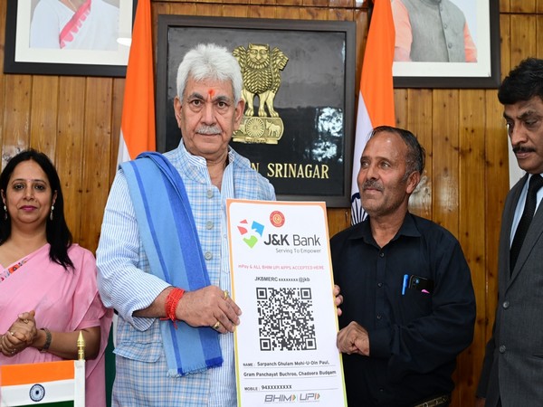 J-K LG hands over land allotment orders to beneficiaries of PMAY-G (Photo/ANI)