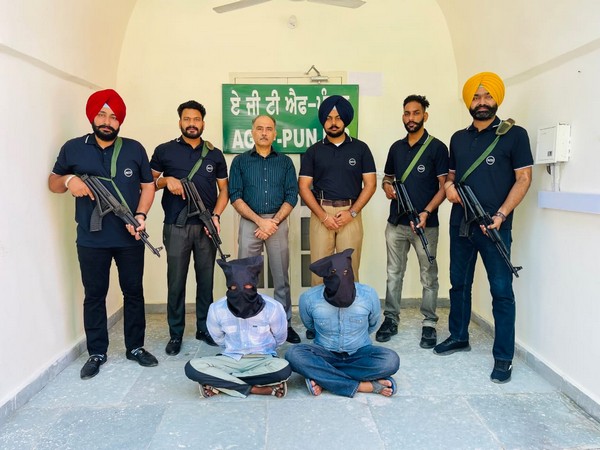 Police with the two arrested associates of the Bambiha Gang (Photo/ANI)