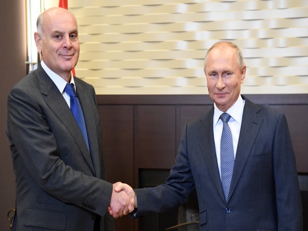 Russia's President Vladimir Putin shakes hands with President of Georgia's breakaway region of Abkhazia Aslan (Photo Credit: Reuters) 