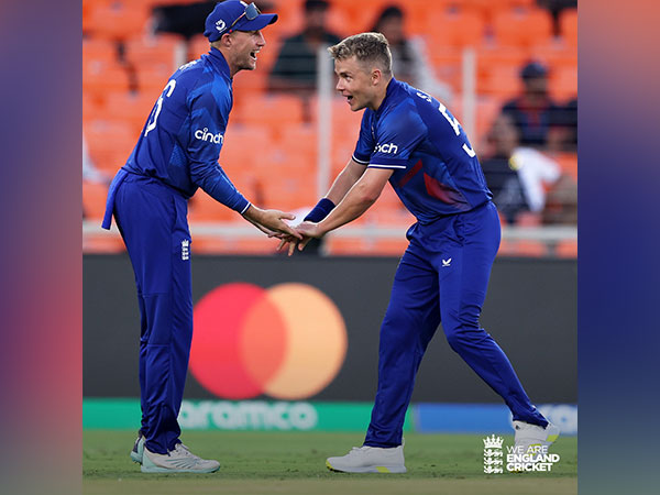 Sam Curran and Joe Root celebrating the fall of only NZ wicket (Photo- England Cricket Twitter)