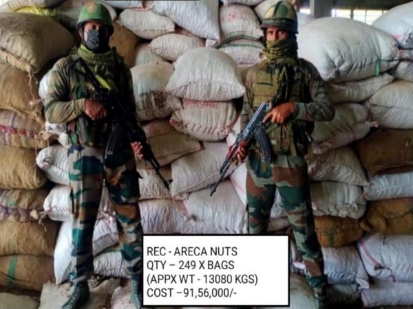Assam Rifles with smuggled areca nuts (Photo/ANI)