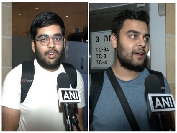 Indian students, Vishesh and Harsh (left), returning from Israel to India.