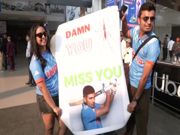 Shubman Gill fan (left) with the banner. (Photo- ANI)