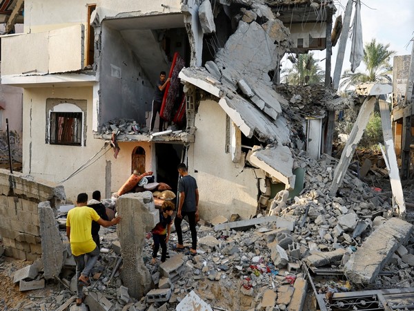 Palestinians carry out belongings from a damaged house in Gaza Strip (File Image) (Picture Credit: Reuters) 